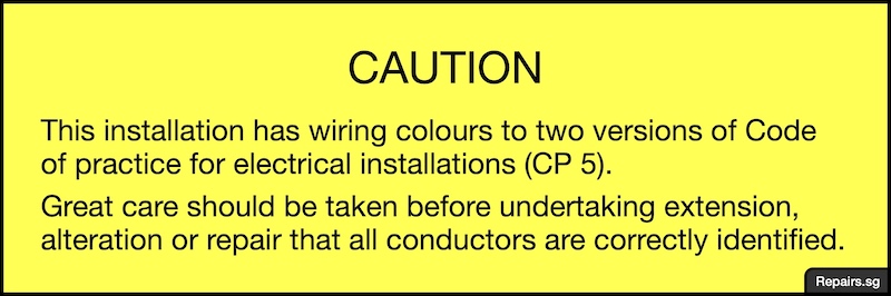 Image of warning notice to inform individuals that there are two versions of cable colour codes used in an electrical installation.